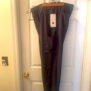 Dark grey scrub pants.